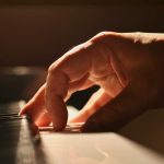 A close-up of a pianist