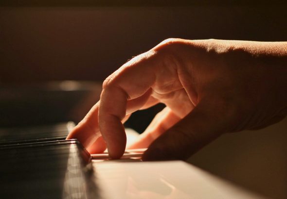 A close-up of a pianist