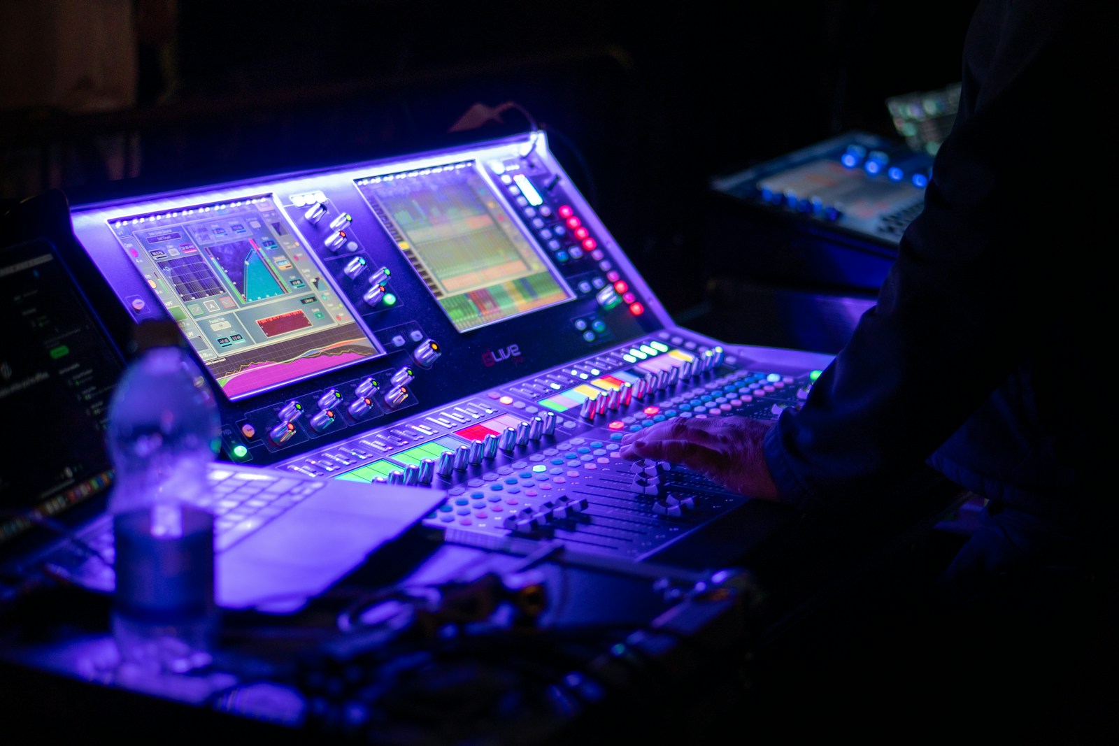 Close-up of a Eurorack modular synthesizer panel with illuminated patch cables during live performance